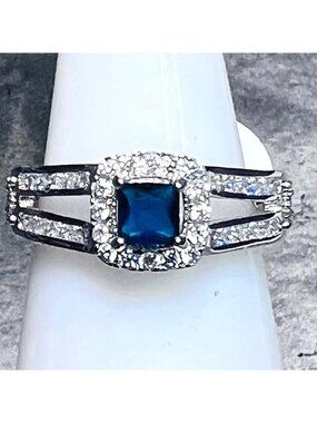 Ring Bomb Party Ring size 6  blue stone CZ type accents, silver color band
